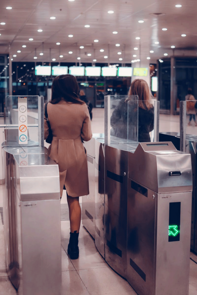 Woman passing a metro door
